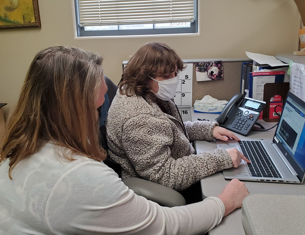 A volunteer with ABVI receiving training on Fusion JAWS and ZOOM Tech software