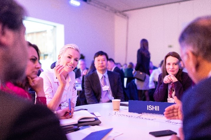 A group of people sitting at a table.