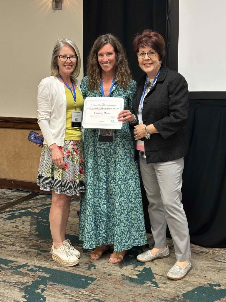 Courtney Plotner receives her award